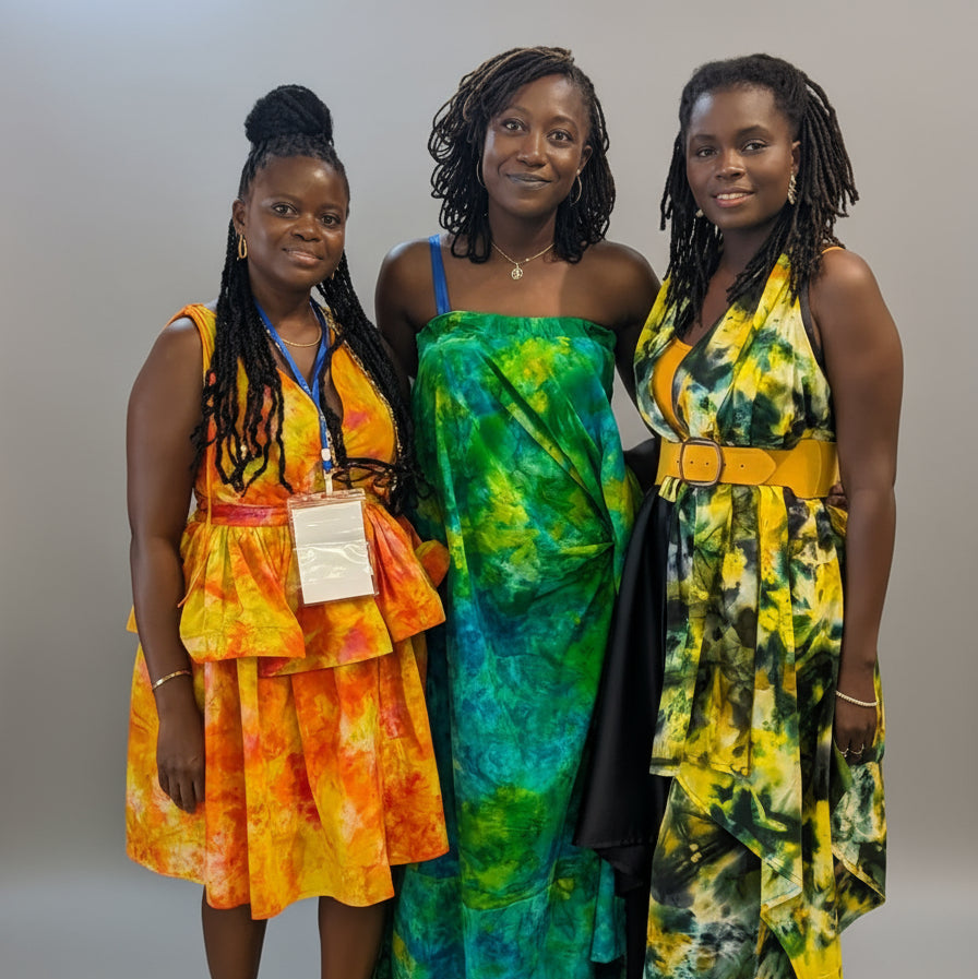 Three women in colourful tie-dye dresses made with Tampoori Bubblegum standing together 