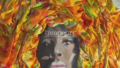 Interior view of Tampoori studio and fabric shop in Accra, Ghana — artisan hand-dyed batik and tie-dye textiles displayed.”